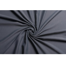 Material textil gri cu aranjament spiralat.