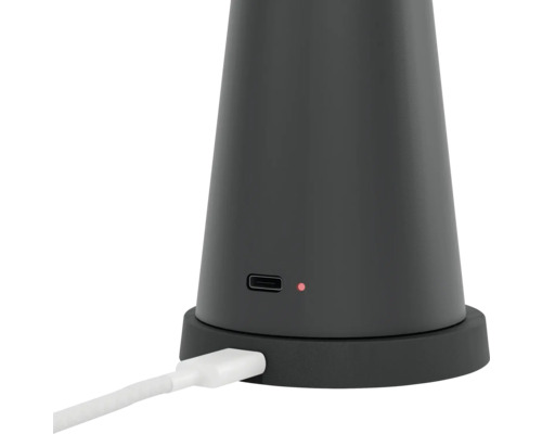 Prim-plan cu un dispozitiv fără fir cu port de încărcare și cablu de încărcare