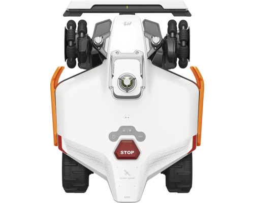 Vedere de sus a unei mașini de tuns iarba robotizate albe cu tracțiune integrală, anvelope negre și buton stop roșu.