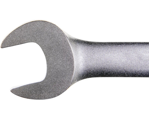 Vedere de aproape a capului unei chei fixe din metal mat