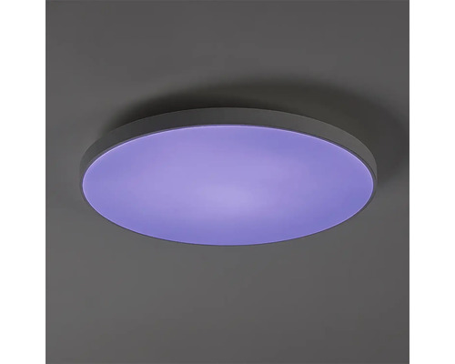 Plafoniera LED rotundă cu design plat și suprafață difuzor luminoasă pentru iluminat interior modern.