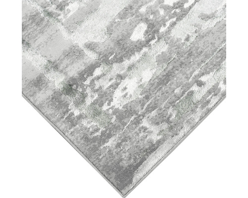 Imagine detaliată cu un covor gri cu model abstract