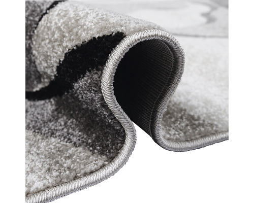 Imagine detaliată a unui covor gri cu model