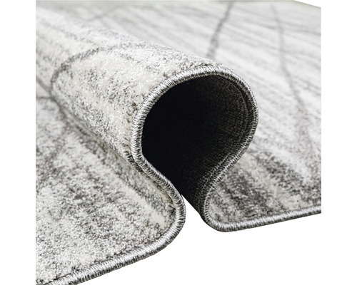 Imagine detaliată a unui covor gri cu model geometric