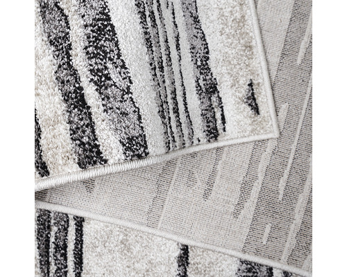 Covor cu model abstract în dungi