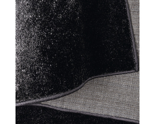 Detalii ale unui covor negru cu textură