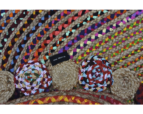 Imagine detaliată cu un covor rotund din iută și material textil