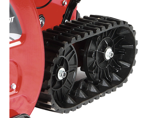 Prim-plan cu șenilele unei freze de zăpadă.