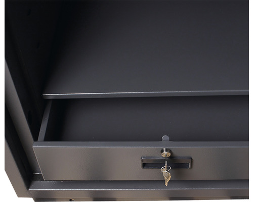 Interiorul unui seif cu sertar și cheie