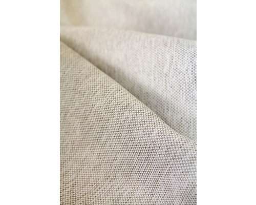 Prim-plan cu o țesătură bej cu structură țesută