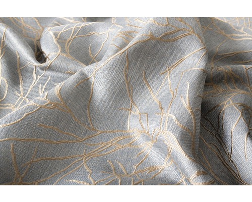 Prim-plan cu țesătură de tapițerie texturată cu motiv floral