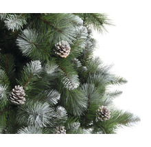 Prim-plan cu un pom de Crăciun artificial cu conuri de brad și vârfuri înghețate