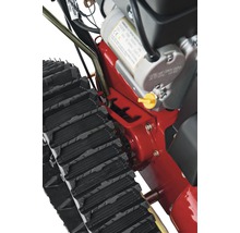 Imagine detaliată cu o freză de zăpadă cu șenile și motor