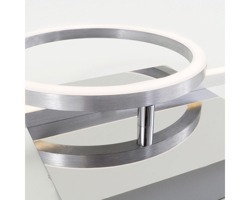 Prim-plan al unei plafoniere LED moderne cu design inelar și carcasă metalică