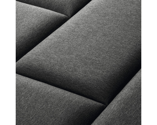 Prim-plan cu un panou de perete gri, matlasat