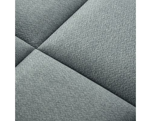 Prim-plan cu o piesă de mobilier tapițată, texturată