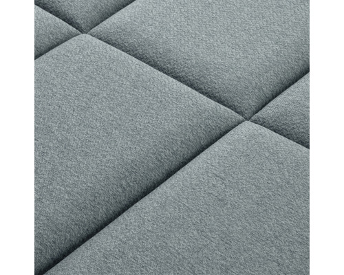 Prim-plan cu un panou de perete tapițat cu un model pătrat