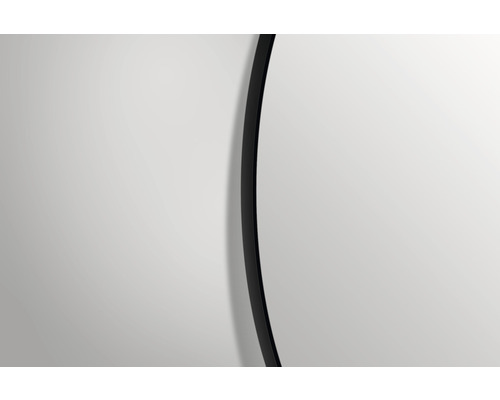 Detaliu al unei oglinzi rotunde cu o ramă îngustă