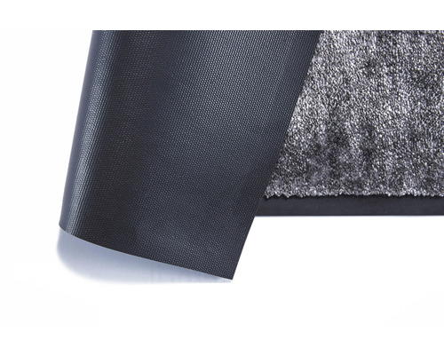 Vizualizare detaliată a unei folii de protecție pentru covoare cu structură