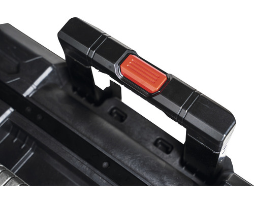 Imagine detaliată a mânerului unei cutii de scule cu buton roșu