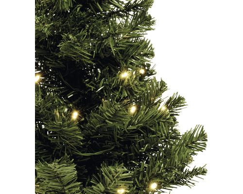 Prim-plan cu un pom de Crăciun artificial, verde, cu iluminare