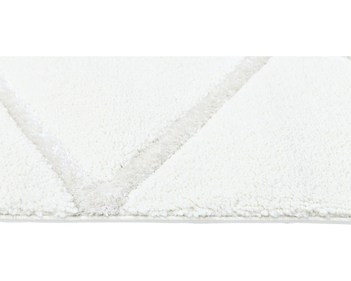 Prim-plan al unui covor cu model geometric