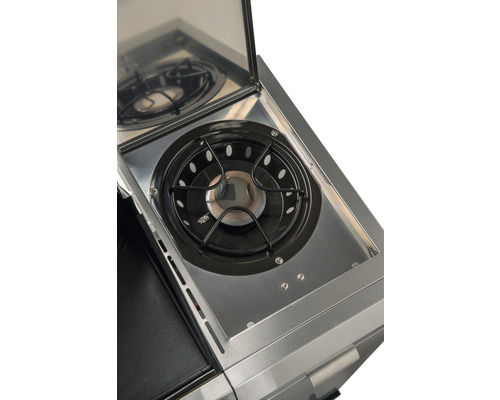 Imagine detaliată cu arzătorul lateral al unui grătar pe gaz