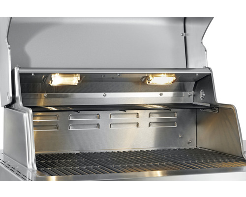 Interiorul unui grătar din oțel inoxidabil cu iluminare