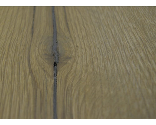 Prim-plan al unui parchet cu rosturi închise la culoare