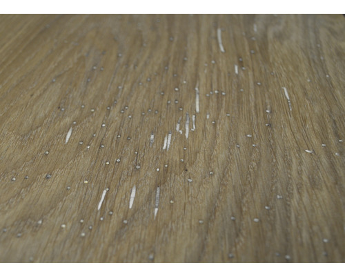 Prim-plan al unei suprafețe de lemn cu granulație și deteriorări minore.