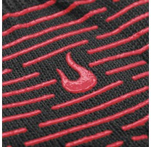 Prim-plan cu o țesătură textilă cu dungi imprimate și un simbol