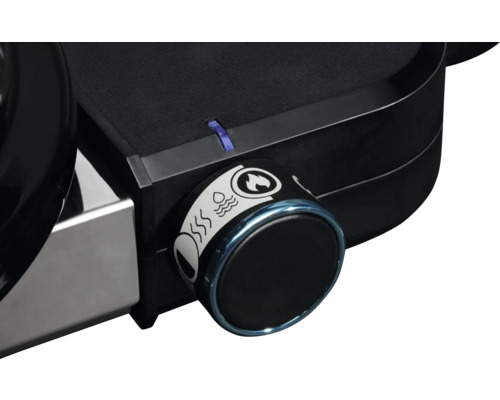 Prim-plan al unui grătar cu regulator de temperatură