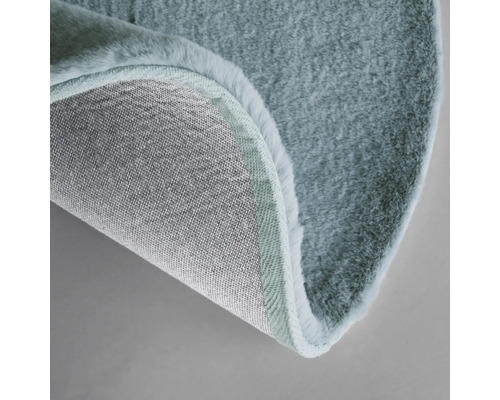 Imagine detaliată cu un covor rotund cu fibre și spate țesut