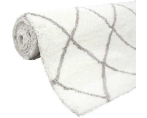 Covor rulat cu model geometric