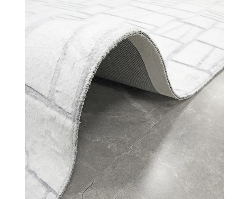 Vizualizare detaliată a unui covor cu model de piatră