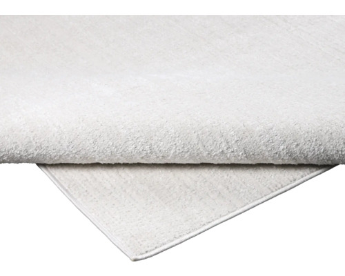 Vizualizare detaliată a unui covor de culoare deschisă