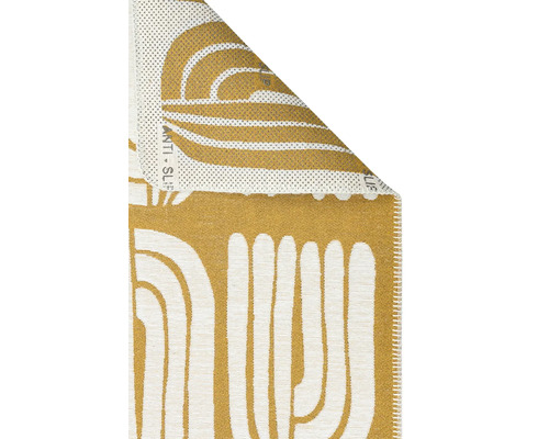 Covor cu model abstract și partea inferioară antiderapantă.