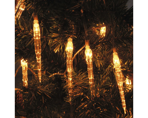 Șir de lumini cu țurțuri pe un pom de Crăciun