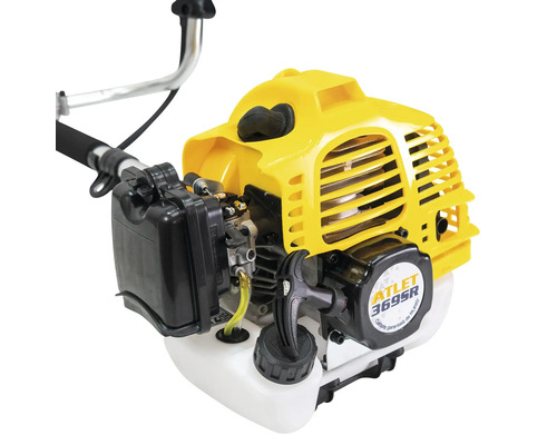 Prim-plan cu o mașină de tuns iarba.