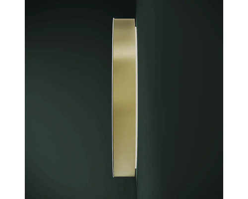 Oglindă rotundă cu ramă metalică pe perete