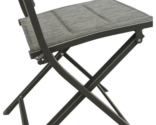 Prim-plan cu scaun pliabil cu tapițerie textilă