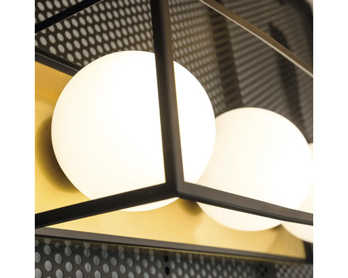 Prim-plan cu o plafonieră cu mai multe abajururi rotunde și un cadru metalic negru