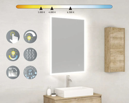 Oglindă iluminată deasupra unei chiuvete în baie. Oglinda are o funcție tactilă, funcție de reglare a intensității luminoase, temperatură de culoare reglabilă, funcție anti-aburire, rotire la 90 de grade și este rezistentă la stropire.
