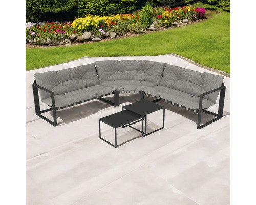 Set de mobilier de grădină cu canapea de colț și două mese pe o terasă