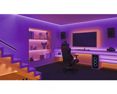 Cameră de jocuri cu birou, monitor, PC de gaming, difuzoare, scaun de gaming și scări cu iluminare