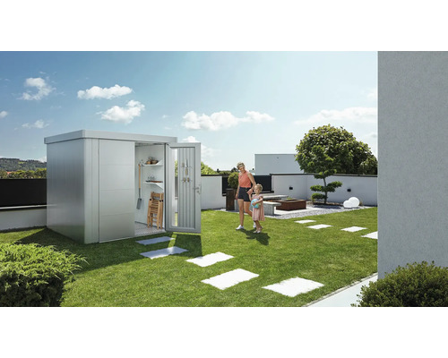 Scenă de grădină cu magazie de scule, mamă și copil pe gazon