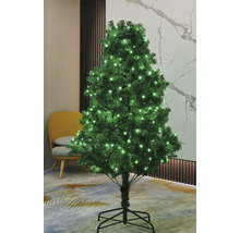 Brad artificial de Crăciun decorat cu iluminare în camera de zi