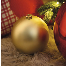 Glob decorativ de Crăciun pe un covor moale