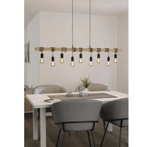 Lampa suspendată cu lemn și opt lumini deasupra unei mese de sufragerie