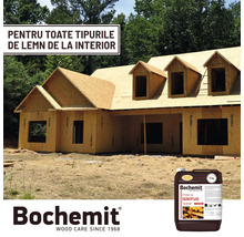 Construcție brută a unei case cu substanță ignifugă pentru lemn de la Bochemit în prim-plan